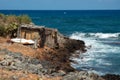 Two huts of palm leaves on the coastline of Crete near Malia