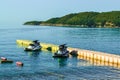 Two hydrocycles near a temporary floating berth on the coast. Water sports. Leisure. Royalty Free Stock Photo