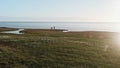 Two hydrologists wearing antimosquito screens on their heads examine ground and make measures. Descover Yamal peninsula.