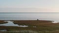 Two hydrologists wearing antimosquito screens on their heads examine ground and make measures. Descover Yamal peninsula.