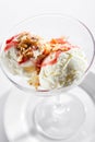 Two Ice Cream Balls or Iced Cream with Strawberry Sauce and Nuts Royalty Free Stock Photo