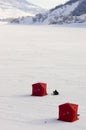 Two Ice Fishing Tents on Frozen Lake