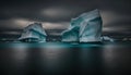 two icebergs floating in the ocean under a cloudy sky Royalty Free Stock Photo