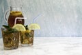 Two iced tea glasses and tea jug Royalty Free Stock Photo