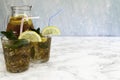 Two iced tea glasses with lemon slice ligth blue background Royalty Free Stock Photo