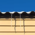 Two icicles hanging from the roof Royalty Free Stock Photo