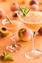 Two icy peach Bellini cocktails ready for drinking. Royalty Free Stock Photo