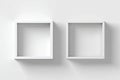 Two Empty White Square Shelves on a White Wall Royalty Free Stock Photo