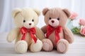 two identical teddy bears with different ribbon colors