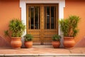 two identical terracotta pots beside a spanish villas door Royalty Free Stock Photo