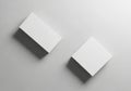 Two identical white and gray boxes standing side by side on a gray surface Royalty Free Stock Photo