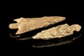Two Indian arrowheads and black background Royalty Free Stock Photo