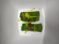 Two Indian paan betel leaves stuffed up with mouth fresher properties ingredient