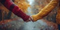 Two individuals grasping hands while standing in the rain Royalty Free Stock Photo