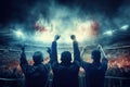 Two individuals raise their hands in triumph, receiving thunderous applause from a lively crowd, Rear view of cheering football Royalty Free Stock Photo