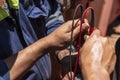 Electrical engineer of the large merchant ship working on the mooring winch motor, focus on his hands and measuring equipment. Royalty Free Stock Photo
