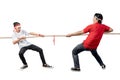 Two Indonesian men celebrate Indonesian independence day on 17 August with the tug of war contest