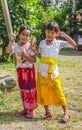 Two Indonesian school girls posing with the peace sign