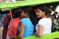 Two Indonesian Women Using Local Transport by Char