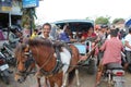 Two Indonesian Women Using Local Transport by Charriot in Kuta L