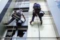 Team of industrial climbers at work, they are washing building f Royalty Free Stock Photo
