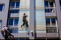 Team of industrial climbers at work, they are washing building f Royalty Free Stock Photo