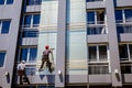 Team of industrial climbers at work, they are washing building f Royalty Free Stock Photo