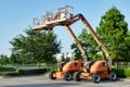 Two industrial hydraulic 600 AJ skyjacks parked together.