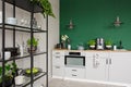 Two industrial lamps above kitchen furniture