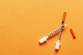 Two insulin syringes on a colored background with place Royalty Free Stock Photo