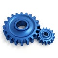 Two interlocking blue metal gears in a mechanical setup Royalty Free Stock Photo