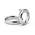 Two interlocking silver rings displaying elegance and unity in a close-up photograph Royalty Free Stock Photo
