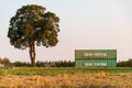 Two intermodal china shipping containers standing on top of each other.