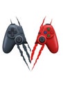 Two intersecting game controllers, one black and one red, appear Royalty Free Stock Photo