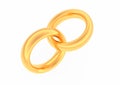 Two intertwined gold wedding rings. Royalty Free Stock Photo