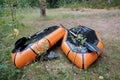 Two inverted packrafts dry in the grass, outdoors. Concept of an active lifestyle. Royalty Free Stock Photo