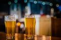 Two IPAs sitting on a table Royalty Free Stock Photo