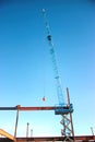 Ironworkers Fit-Up a Steel Beam Suspended from Crane Royalty Free Stock Photo