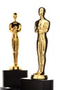 Two Isolated Golden Statuettes Royalty Free Stock Photo