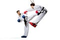 Two isolated professional female karate fighters Royalty Free Stock Photo