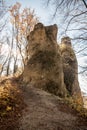 Two isolated sandstone rocks with colorful trees around and clear sky in autumn Sulovske skaly mountainy in Slovakia Royalty Free Stock Photo