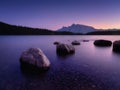 Two Jack lake. Mountain landscape at dawn. Sunbeams in a valley. Lake and forest in a mountain valley at dawn. Banff National Pa