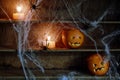 Two Jack o Lanterns Carved from Oranges on Shelf Royalty Free Stock Photo