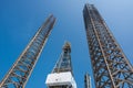 Two jack up oil and gas rig leg and derrick with blue sky when almost fu Royalty Free Stock Photo