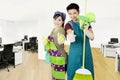 Janitors with cleaning equipment in the office Royalty Free Stock Photo