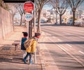 Two Japanese kids is waiting for school bus at Bus stop
