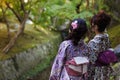 Two Japanese women in a Japanese garden Royalty Free Stock Photo