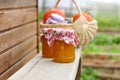 Two Jars of Pumpkin Jam on a Bench Royalty Free Stock Photo