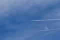 Two planes leaving wake in the blue sky Royalty Free Stock Photo