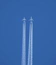 Two jet two-turbine aircraft in flight on blue sky background Royalty Free Stock Photo